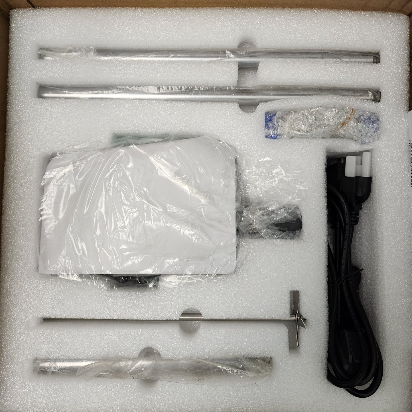 Labnique digital overhead stirrer components unboxed, packed in protective foam.