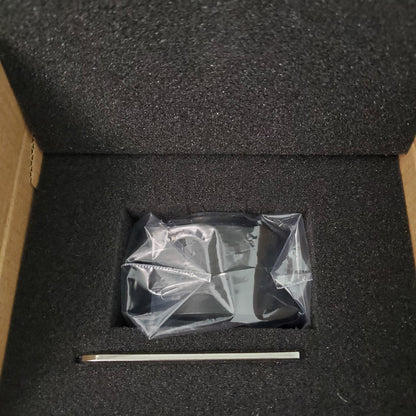 Olympus 0.5x camera adapter kit in a protective storage box with included hex key for focus adjustment.