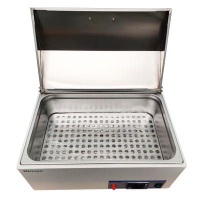 Overhead view of a Microyn water bath with its lid open, revealing the stainless steel inner chamber and perforated sample rack.